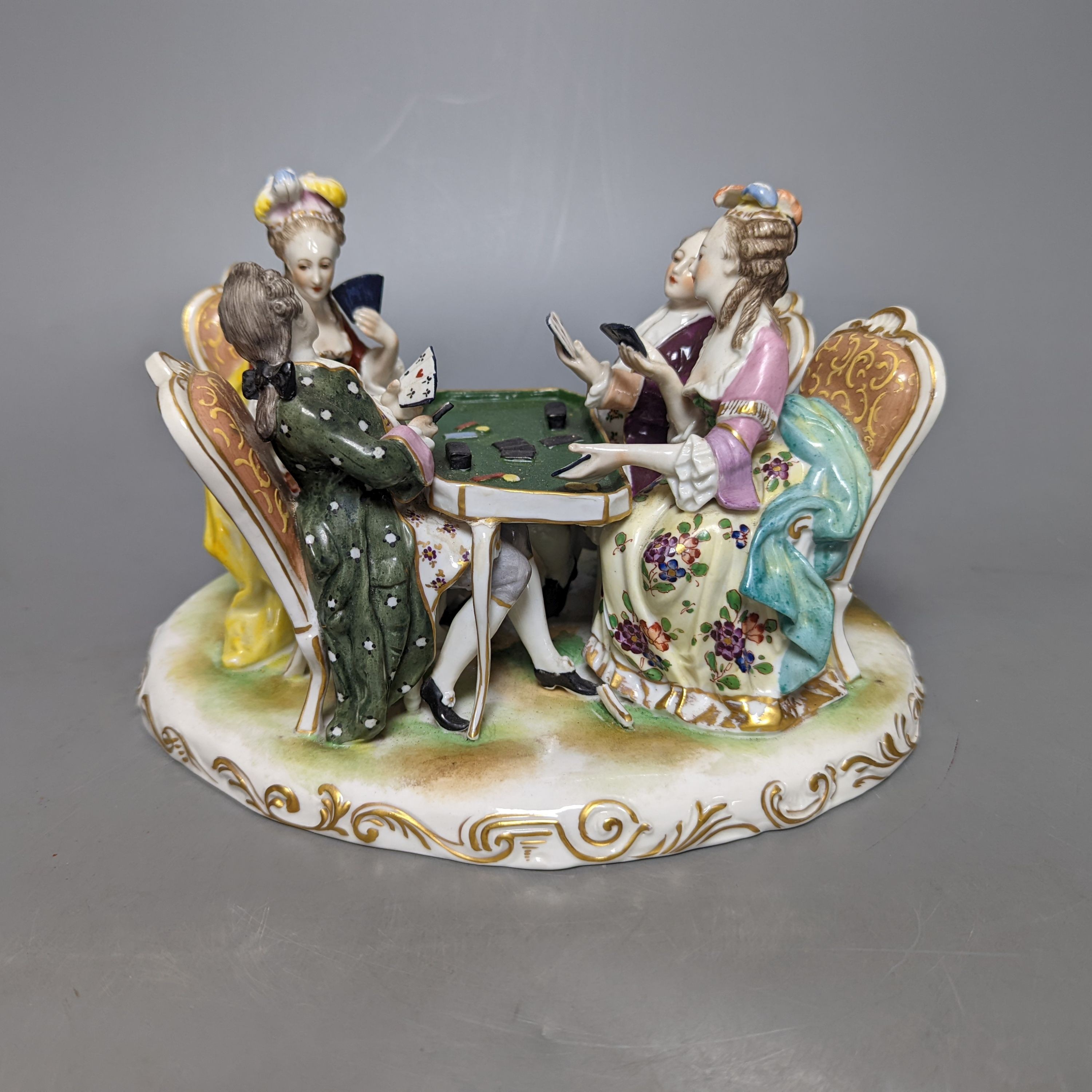 A German porcelain group of figures at a games table 21cm